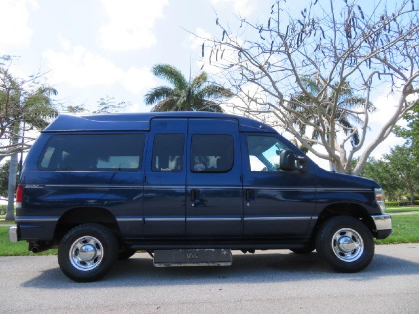 2011 Dark Blue /Gray Ford E-Series Wagon E-350 XLT Super Duty (1FBNE3BS4BD) with an 6.8L V10 SOHC 20V engine, located at 4301 Oak Circle #19, Boca Raton, FL, 33431, (954) 561-2499, 26.388861, -80.084038 - You are looking at a Gorgeous 2011 Ford Econoline E350 XLT Norcal Max High Top Handicap Wheelchair Conversion Van with 6.8L V10, 15K Original Miles, 9 Inch Lowered Floor, Braun UVL Side Entry Wheelchair Lift, Remote Control Power Side Entry Doors, Expanded Side Entry Doors, Q Straint Tie Down, Syste - Photo#4